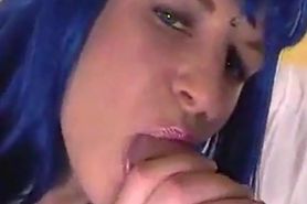 Blue wig crossdresser blowing
