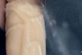 Squirting on her dildo