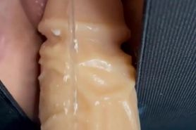 Squirting on her dildo