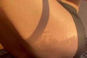 Rubbing her shaved pussy