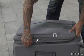 Spinner dragged in public in suitcase