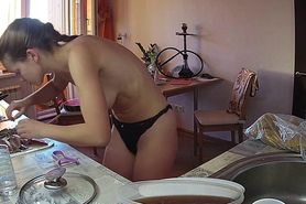 Young wife with perky tits spied while cooking