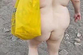 BBW Nudist walking in desert