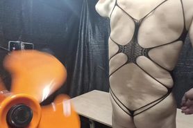 A cross-dressing guy whipping with rubber attached to t