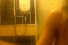 Cute Goth rubs herself in the shower