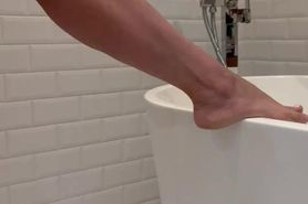 Jane putting lotion on her legs