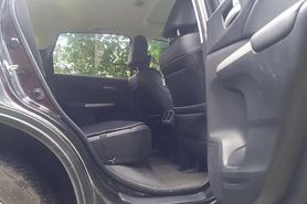 Sissy slut pleases her insatiable pussy in the backseat