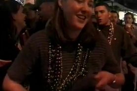 April  Lander gets her nipple kissed at mardi gras