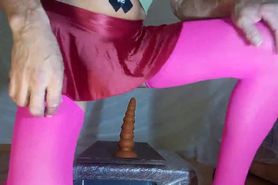 The slut is being impaled on a long plug