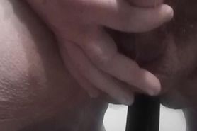 Stroking cock while ass is filled up