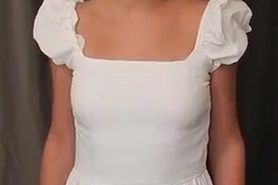 Young woman shows small tits