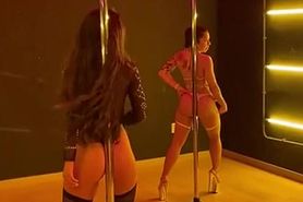 2 Girls Perform Synchro Pole Dance