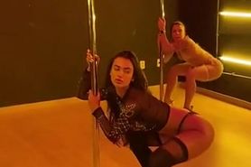 2 Girls Perform Synchro Pole Dance