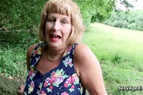 British blonde granny Rosemary plays with her pussy out