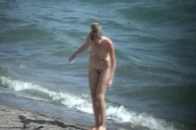 Busty Blonde walking nude on Beach