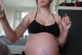 Fertile Pregnant Girl Oiling Belly