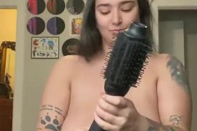 Gelluh doing her hair topless