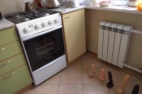 a man sit on 6 dildos in the kitchen 0147