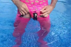 Sissy having fun with a butt plug in the pool