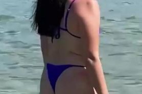 Asian in thong at beach