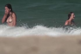 Topless girls in surf