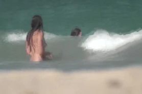 Topless girls in surf