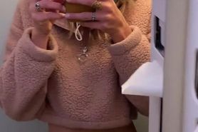 Steph peeing in the airplane lavatory