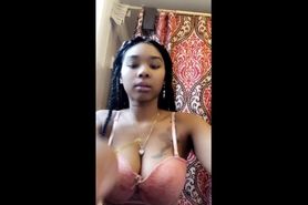 Ebony teen shows her tits