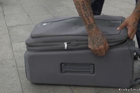 Spinner dragged in public in suitcase