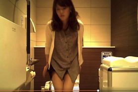 Sexy young lady on the toilet