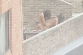 Lesbian fuck on balcony