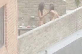 Lesbian fuck on balcony