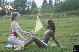 Dark and white chocolate lesbian play in the outdoors