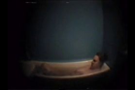 Busty mother masturbates in bath