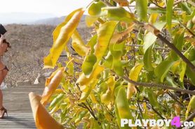 Pretty MILF model with perfect big tits posing outdoor