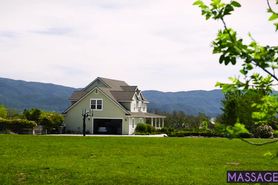 Hot blonde busty MILF massage clients body and cock