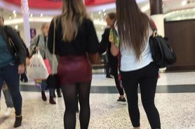 Shop assistant out for lunch in leather miniskirt with 