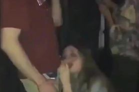 Extremely horny girl sucks cock in crowded club