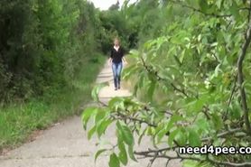 Hot redhead squats and pisses on the side walk