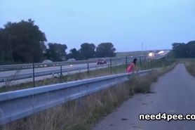 Smoking hot brunette pissing nearby a bridge