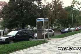 Gorgeous blonde pissing on a bench outdoor