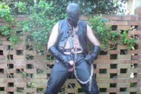 Leather Master in hood and chains