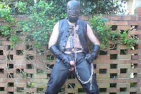 Leather Master in hood and chains