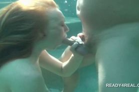 Redhead hottie eats cock underwater for cash