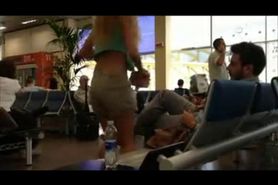 Tourist At An Airport Shows Some Side Boob