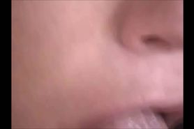 She licks his penis - closeup