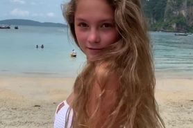 Teen showing off hot bikini on the beach