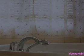 Busty Eufrat rubs pussy in the bathtub