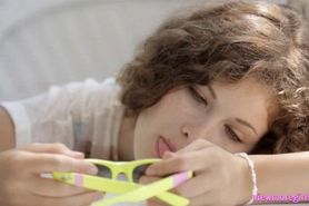 Curly haired teen Vanessa shows pussy