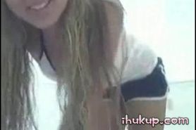 Young blonde strips on webcam